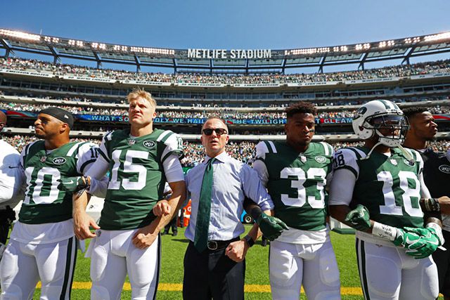 Jets acting owner, Christopher Johnson, stands with Jermaine Kearse #10, Josh McCown #15, Jamal Adams #33 and ArDarius Stewart #18 on September 24, 2017